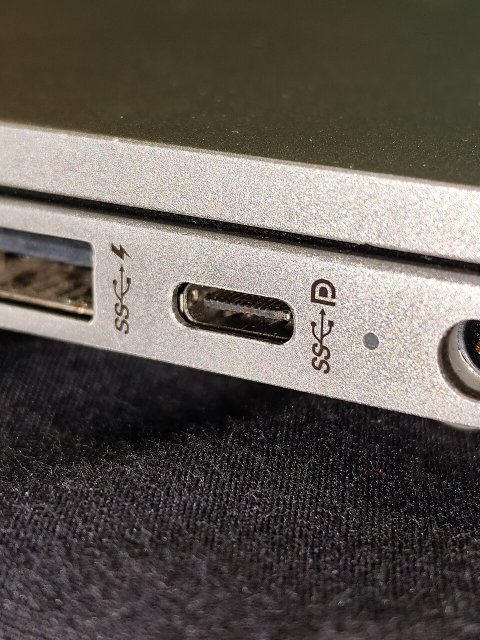 USB-C connector port on laptop side showing charging port location and design for repair USB-C connector port on laptop side showing charging port location and design for repair