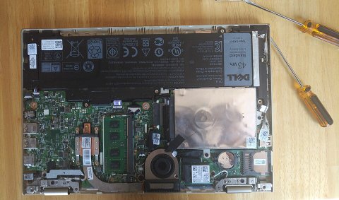 Dell XPS 13 laptop internal components visible during disassembly for BIOS rollback guide