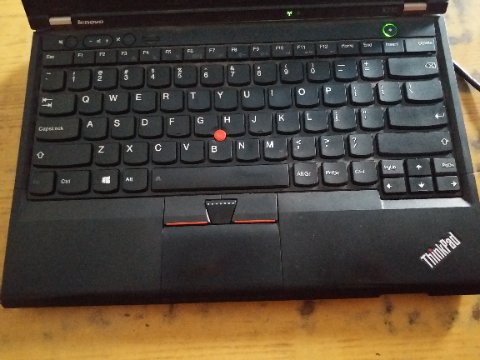 Laptop keyboard and wide touchpad surface showing accidental palm activation area below spacebar Laptop keyboard and wide touchpad surface showing accidental palm activation area below spacebar