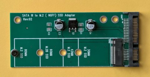 SATA to M.2 adapter board showing difference between SATA and NVMe SSD interfaces SATA to M.2 adapter board showing difference between SATA and NVMe SSD interfaces