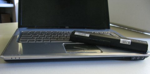 HP laptop with battery showing charging connection and ACPI battery driver status HP laptop with battery showing charging connection and ACPI battery driver status