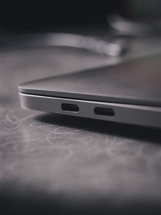 Lenovo Yoga USB-C ports close-up on gray surface