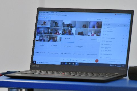 Lenovo ThinkPad laptop open on desk for keyboard driver reinstallation procedure Lenovo ThinkPad laptop open on desk for keyboard driver reinstallation procedure