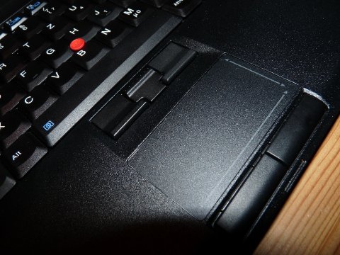 Lenovo ThinkPad UltraNav touchpad and TrackPoint middle button close-up view