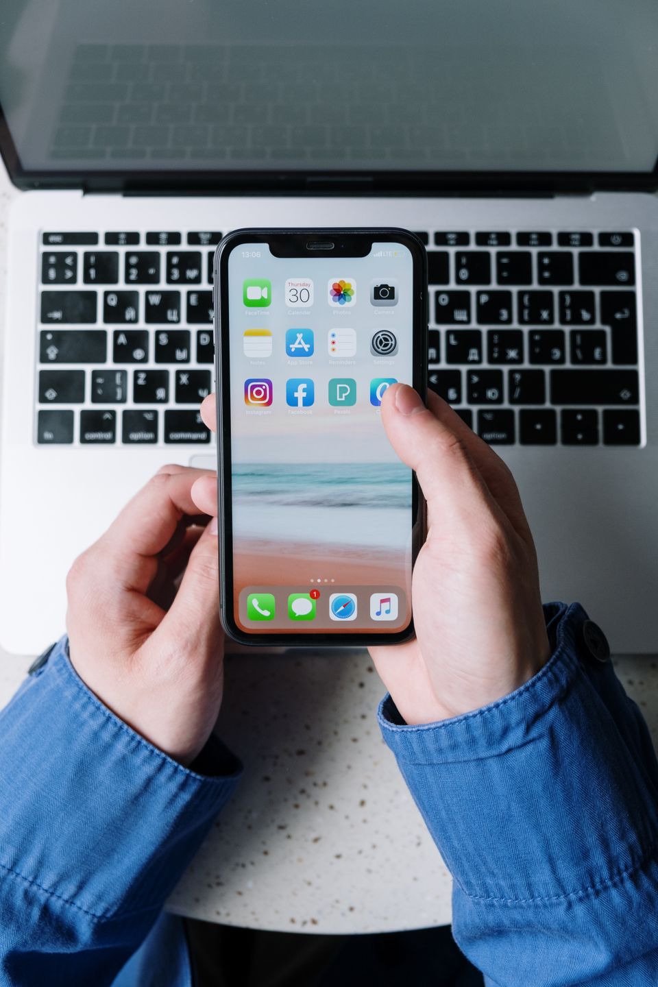 Person holding a smartphone to confirm the Imou Life mobile app Person holding a smartphone to confirm the Imou Life mobile app
