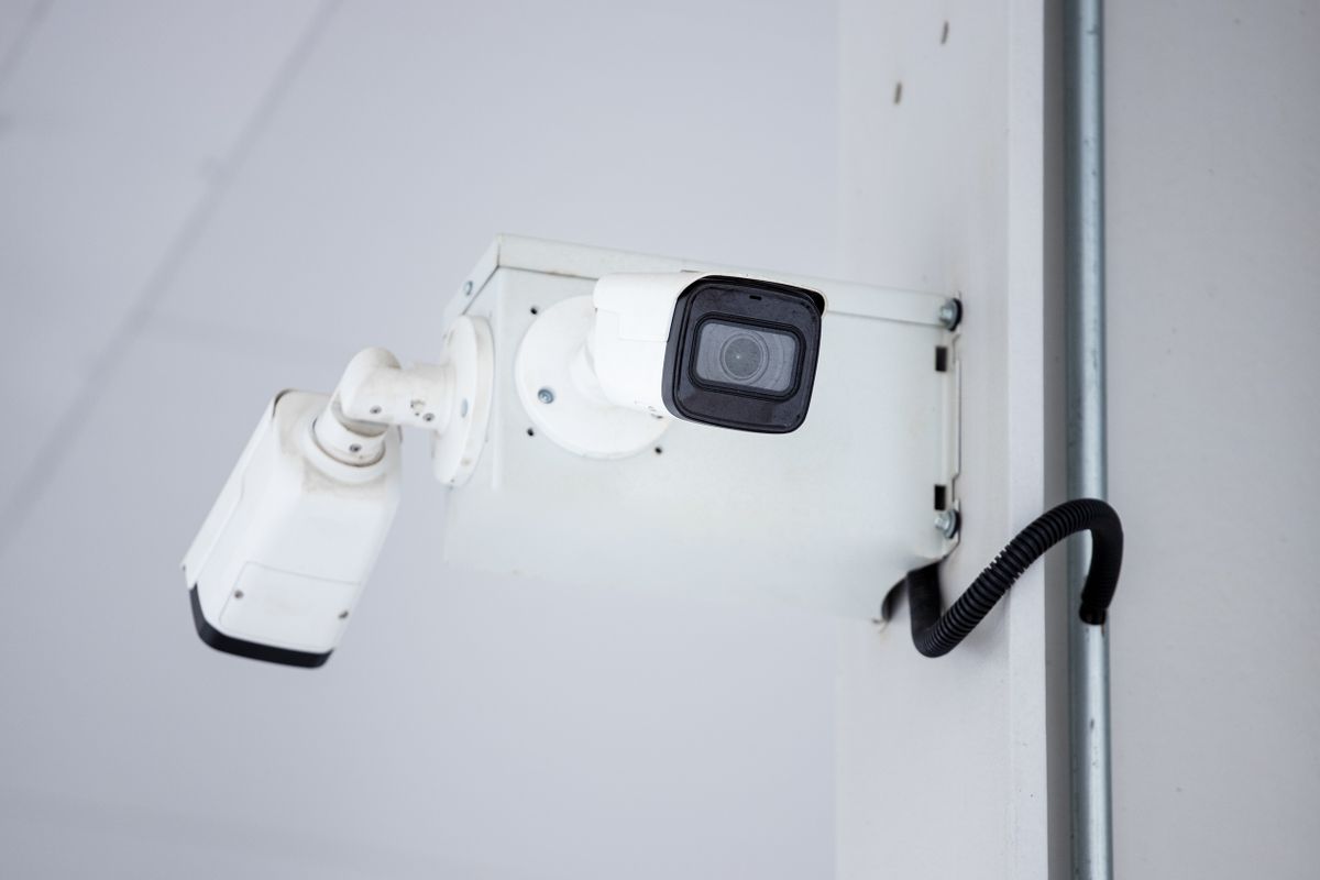 Imou security camera mounted on wall showing normal status light behavior Imou security camera mounted on wall showing normal status light behavior